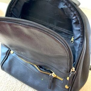 Mossimo blank faux leather back pack hand bag.